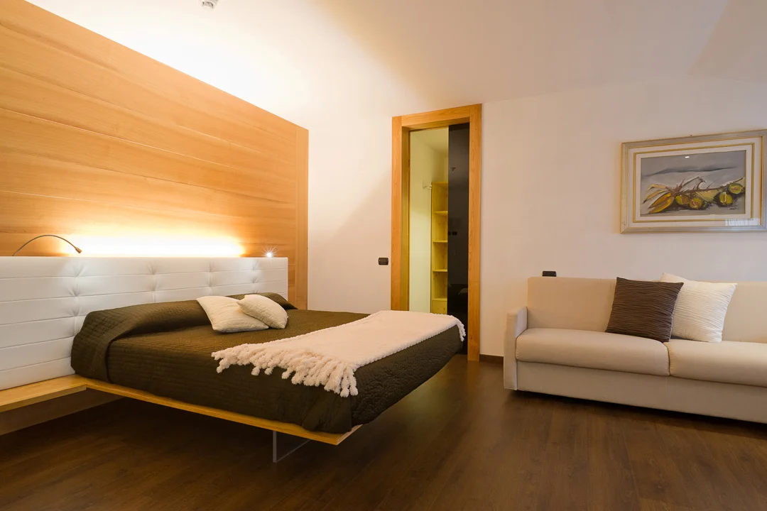 Suite with suspended double bed and sofa bed Suite with suspended double bed and sofa bed